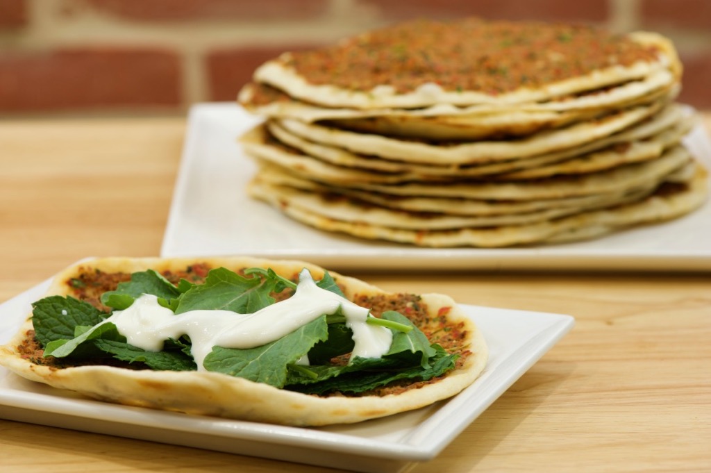 lahme b'ajeen with homemade yogurt, fresh mint, and baby kale lahme b'ajeen with homemade yogurt, fresh mint, and baby kale