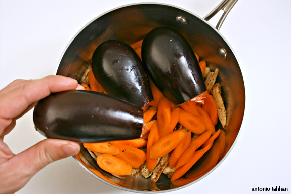 placing the eggplants in pot