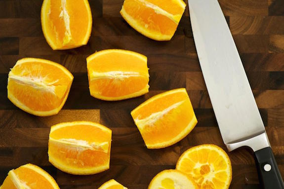 cut oranges into quarters