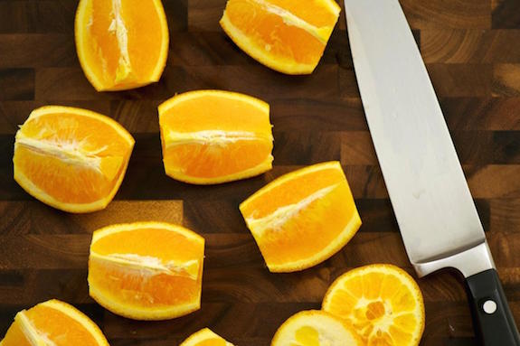 cut oranges into quarters cut oranges into quarters